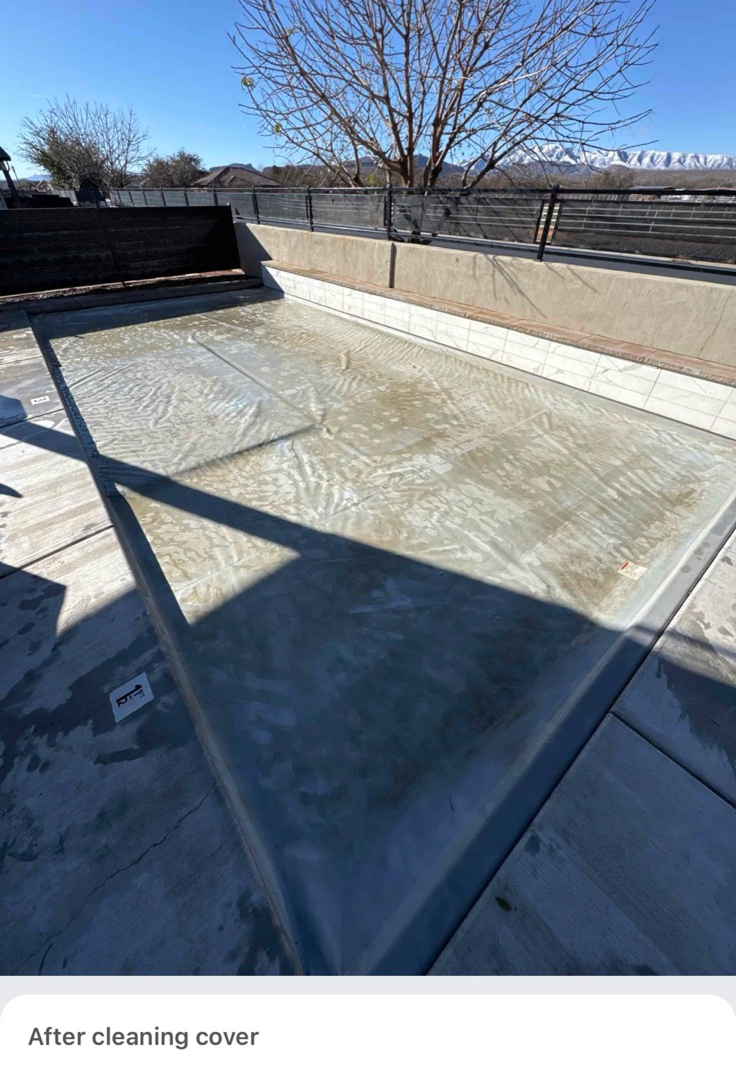 Serviced pool cover with mountain backdrop